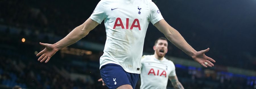 Harry Kane Celebrating after his last minute winner with his arms out.