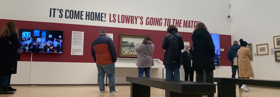 People viewing 'Going to the Match' painting