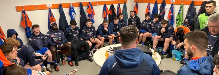 The Man Met rugby squad preparing for a game n their dressing room
