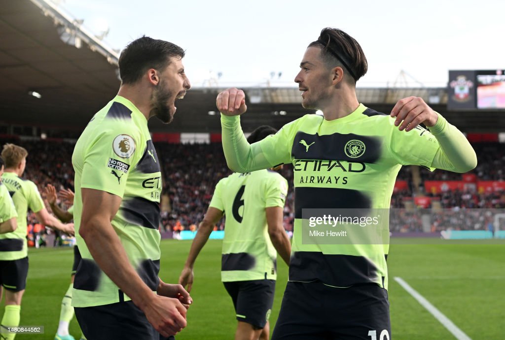 Rúben Dias and Jack Grealish Celebrating his goal in front of the fans.