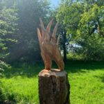 A wood carving of a heron in Boggart Hole Clough