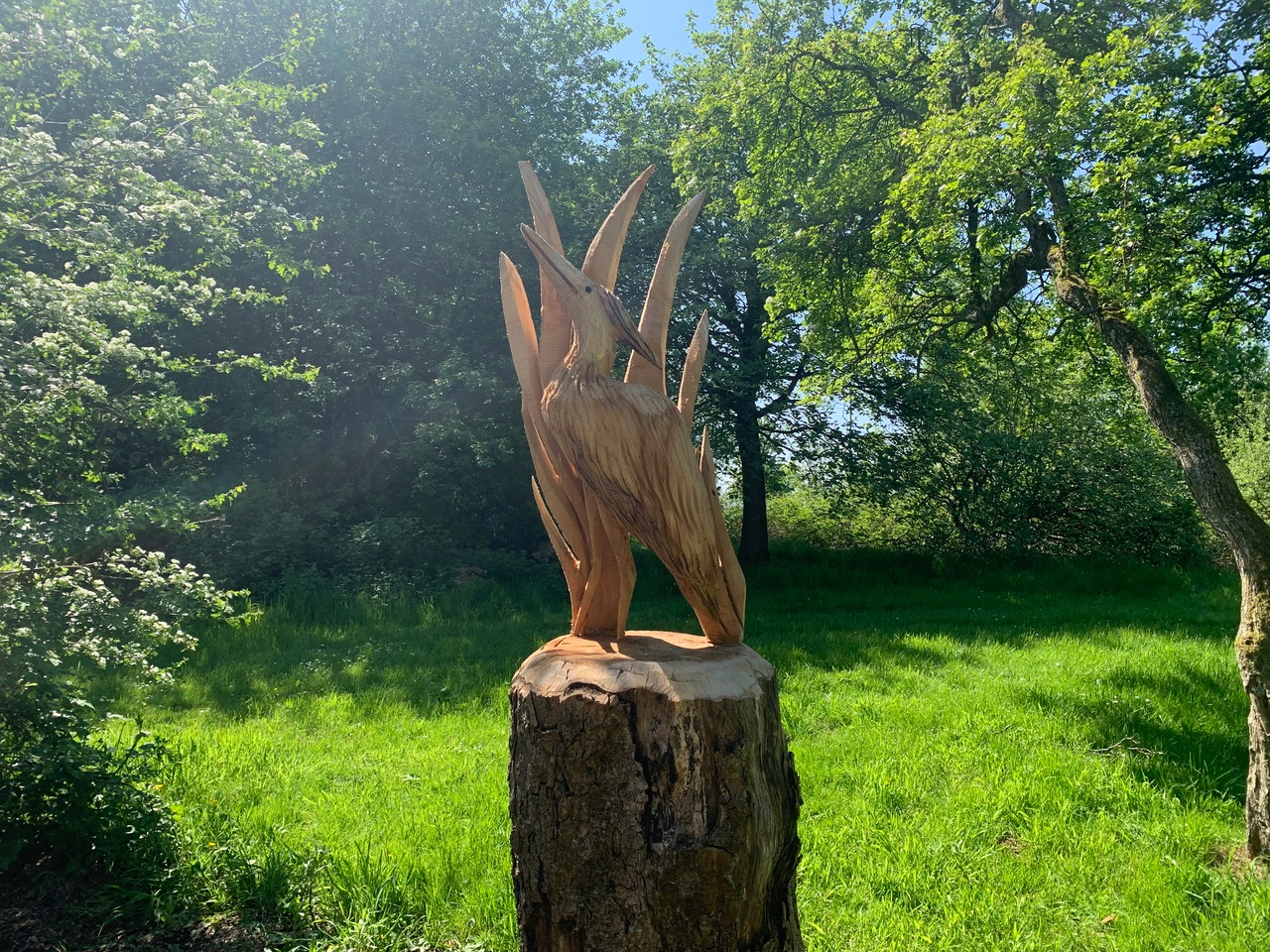 A wood carving of a heron in Boggart Hole Clough