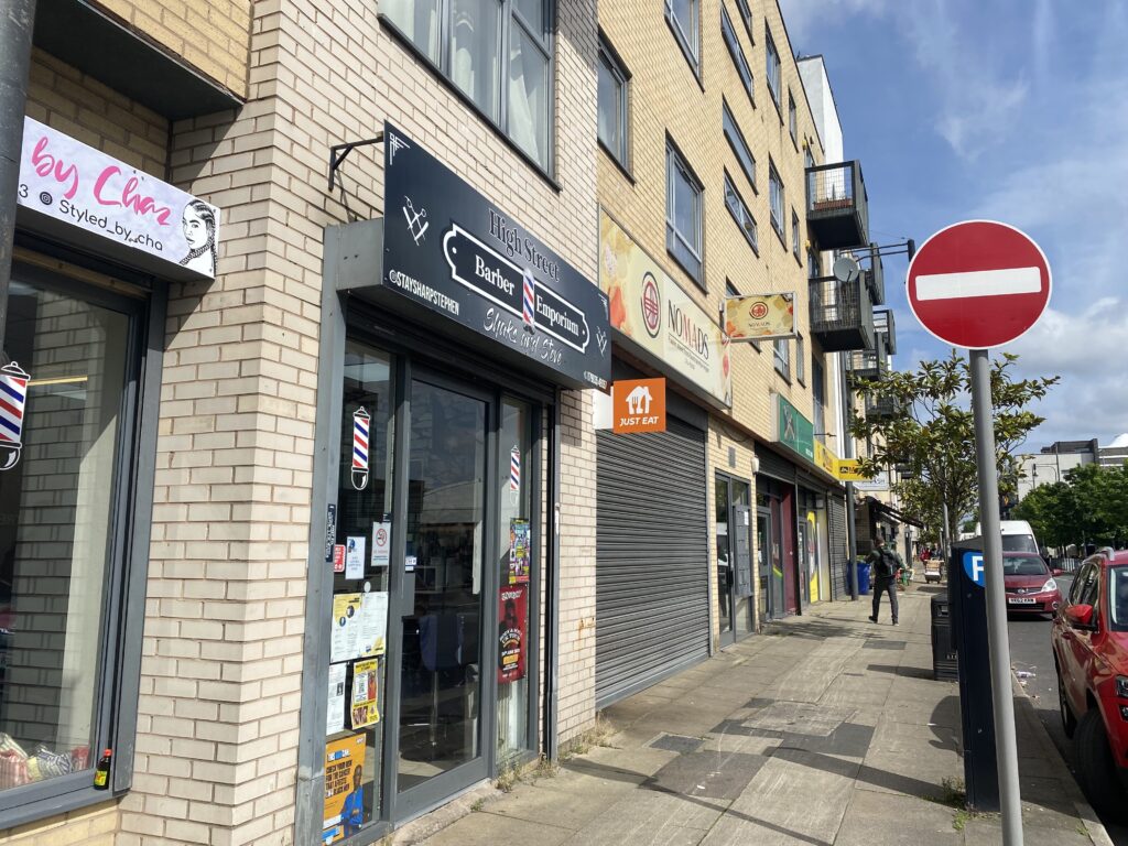 Row of shops, including Shaks and Steve's barbers