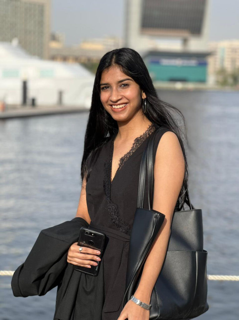 Man Met fashion student Khushreet Johal in summer attire against backdrop of water