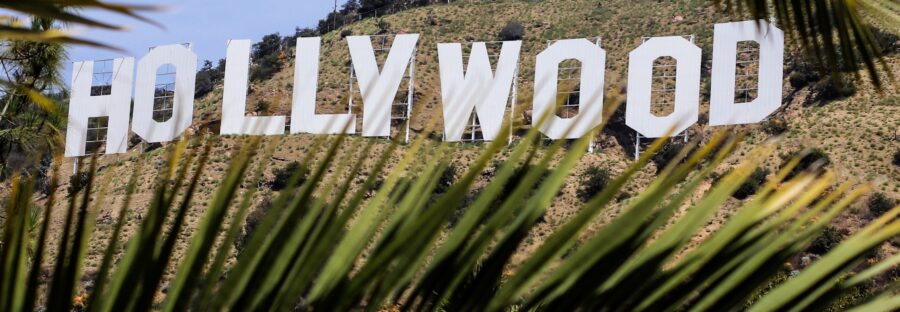 Hollywood written in white big letters across a field