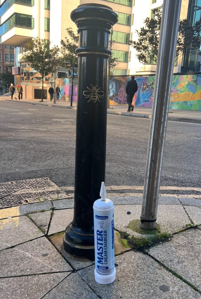 A Laughing gas canister is discarded on Ducie Street in Manchester's city centre.