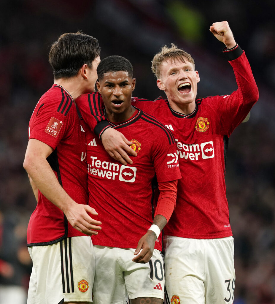 Manchester United's Marcus Rashford (centre) and team-mates Scott McTominay and Harry Maguire (left) celebrate after the full-time whistle during the Emirates FA Cup quarter-final match at Old Trafford, Manchester