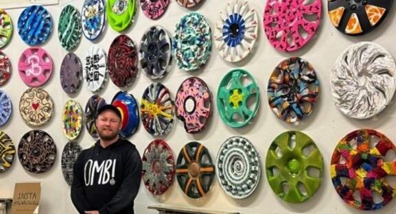 Nick Entwistle infront of his art.