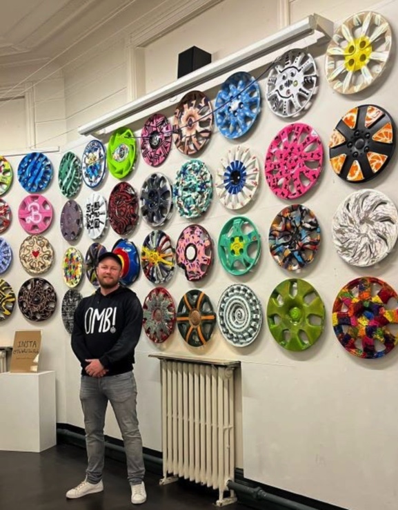 Nick Entwistle infront of his art.