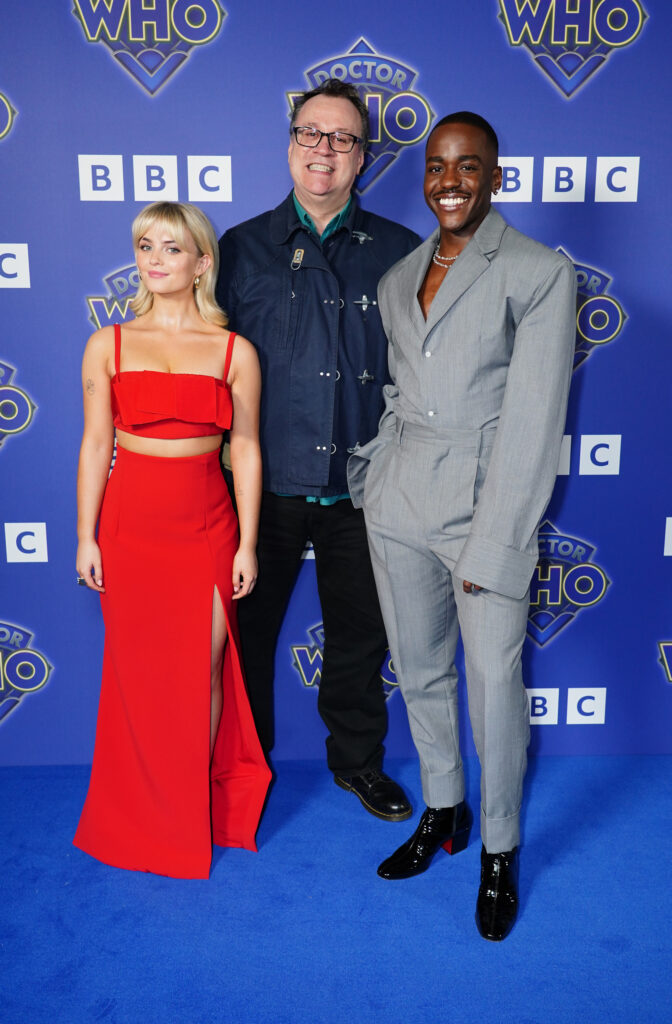 An image of the new Doctor Who team, Millie Gibson, Russell T. Davies and Ncuti Gatwa