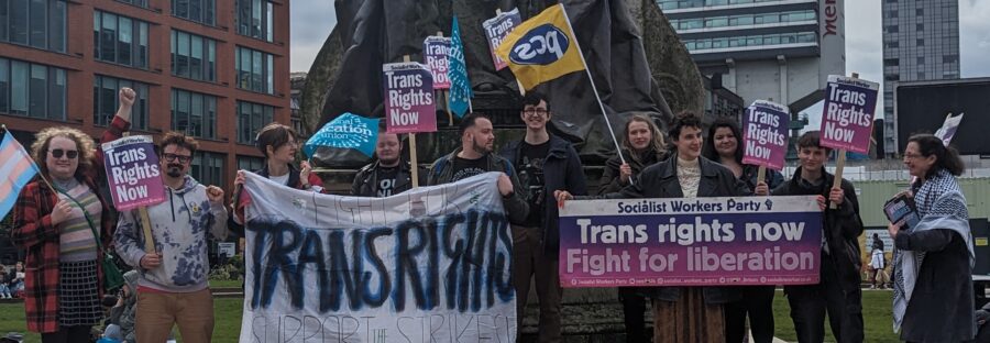 Image of the protest against the findings for the Cass report, holding trans rights now signs