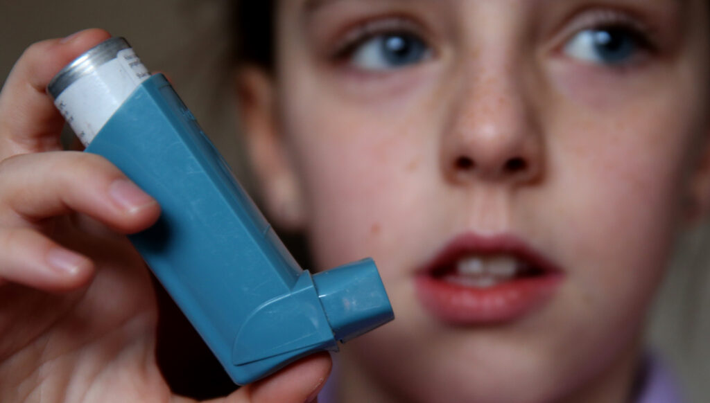 Child with blue inhaler 
