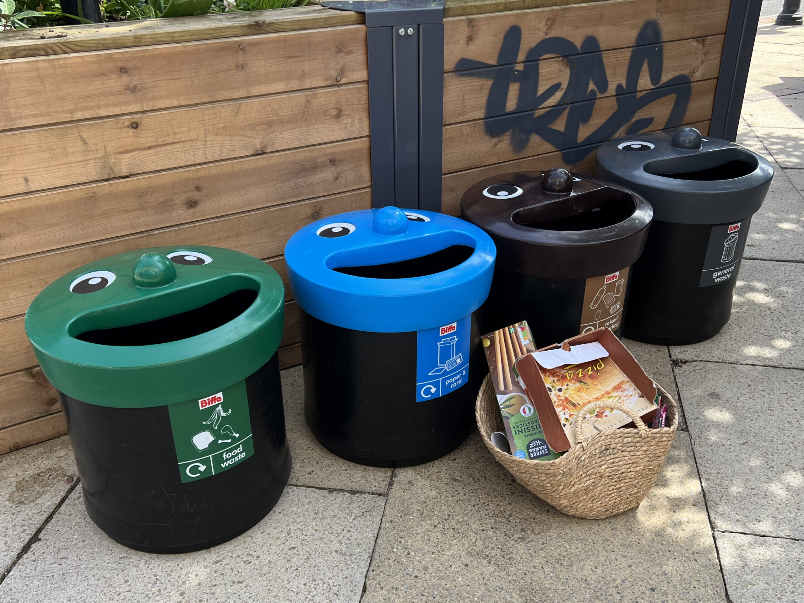 Biffa's bins to demonstrate recycling. Green, Blue, Brown and Black bins. Green is for food waste. Blue is for paper and card. Brown for mixed recycling and black for general waste.