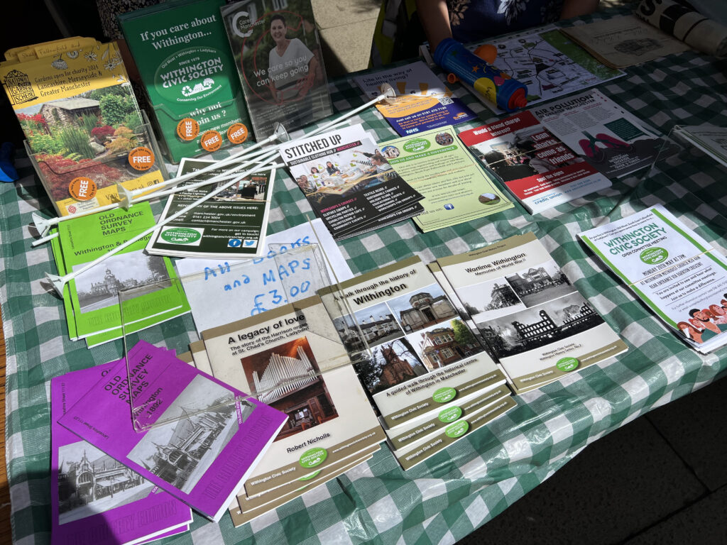 Multiple books on Withington history being sold at stall.