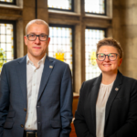 Manchester chief executive Tom Stannard stood next to council leader Bev Craig inside the town hall