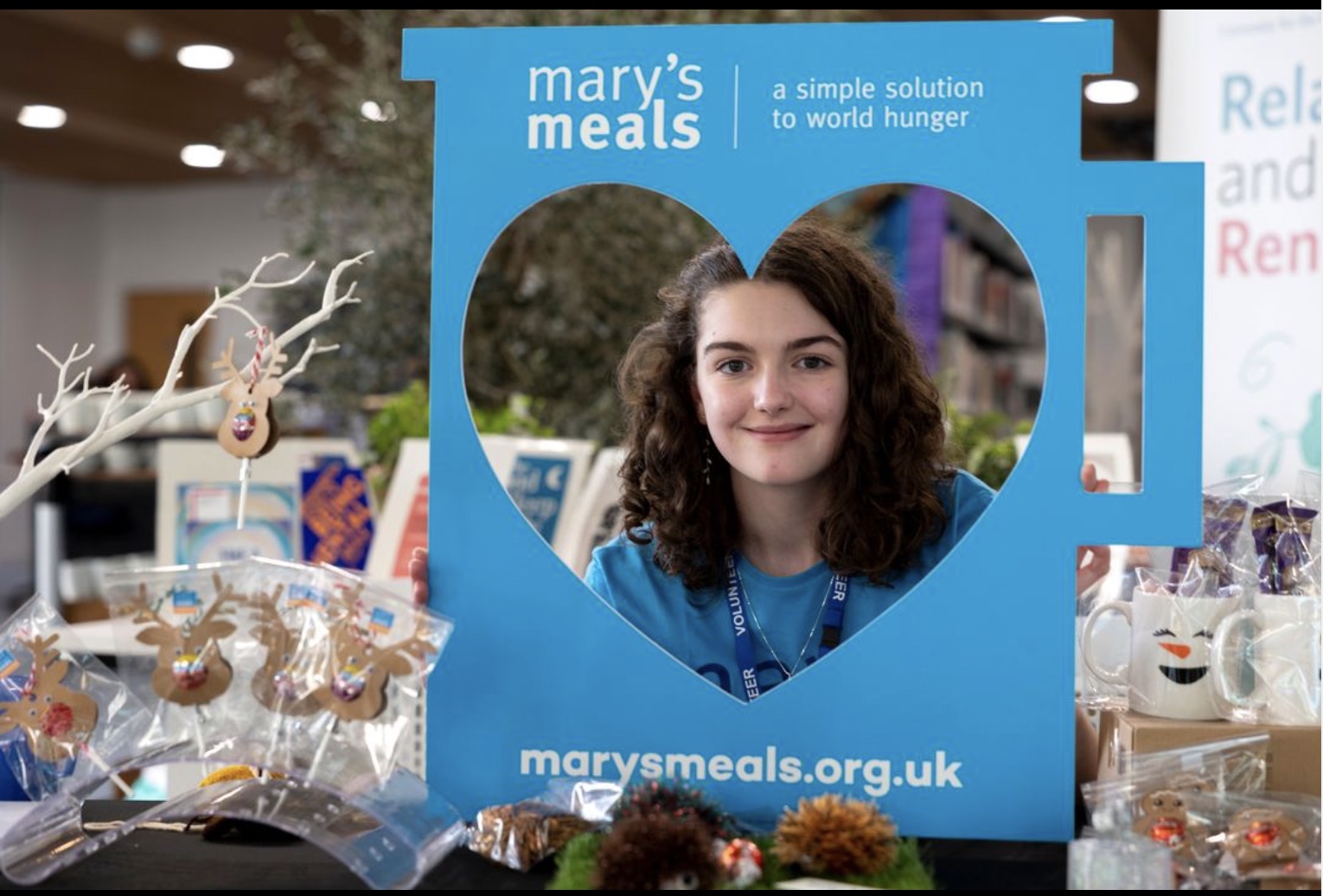 Girl smiling at Marys meals charity fundraising event