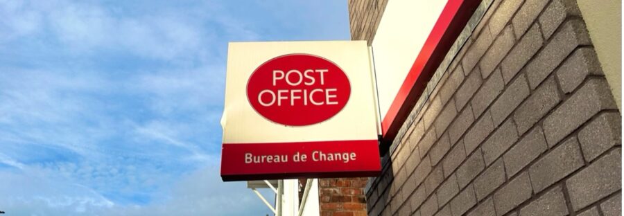 Post Office sign outside branch in Manchester