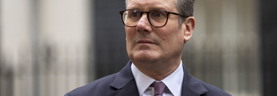 PM Keir Starmer stood in front of Downing Street.