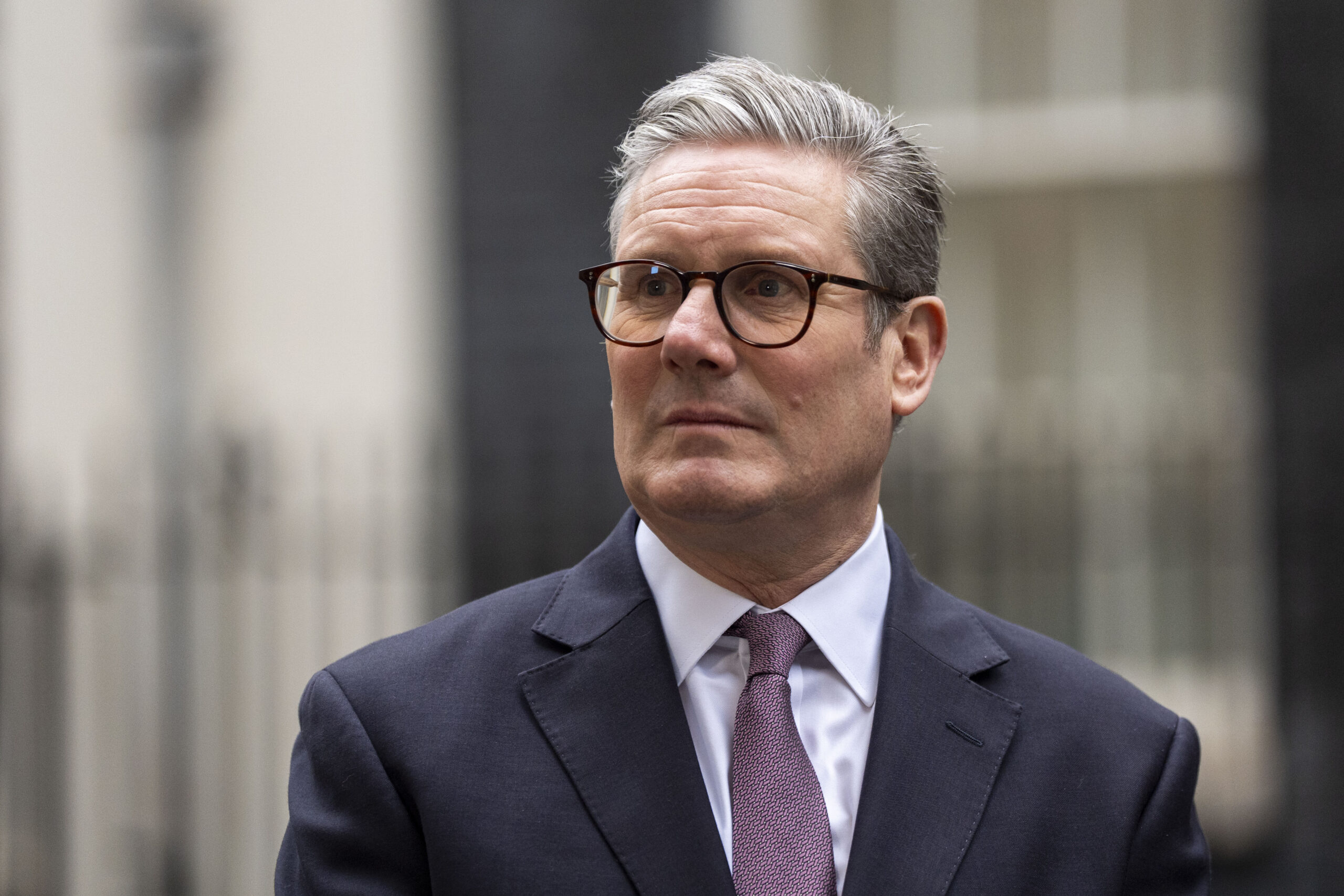 PM Keir Starmer stood in front of Downing Street.