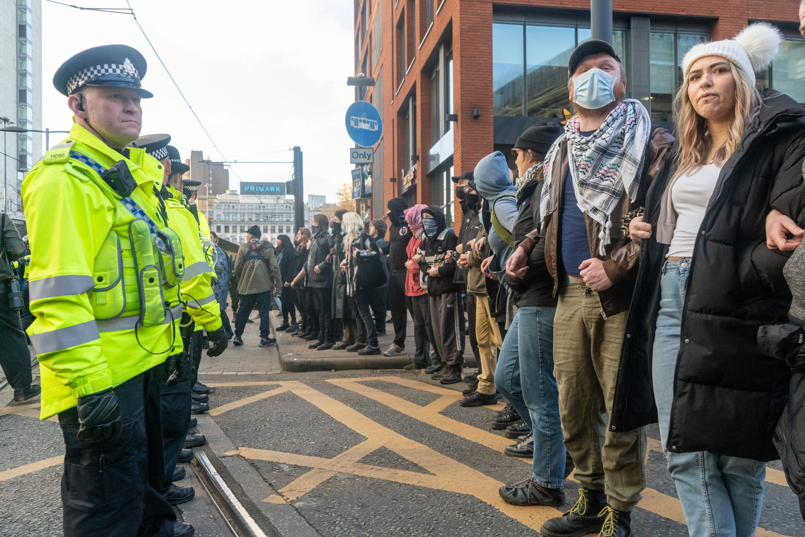 Police and counter protestors line up