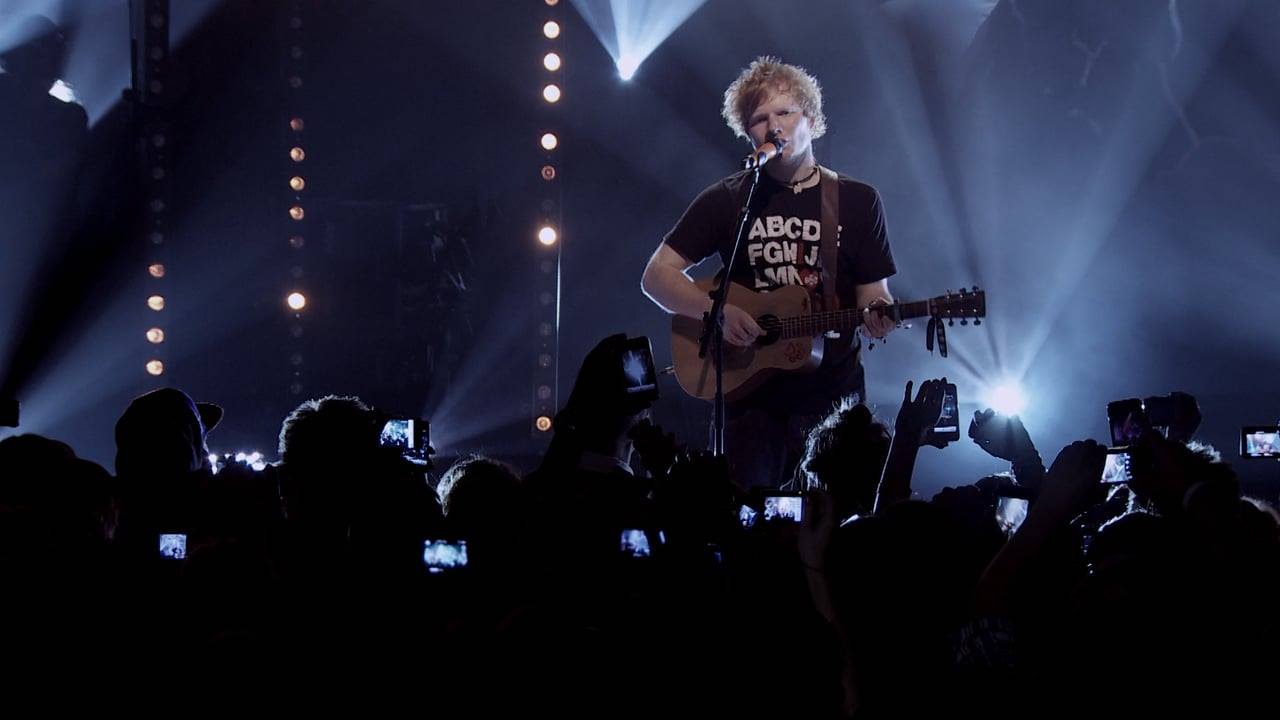 Singer-songwriter, Ed Sheeran, playing acoustic guitar live