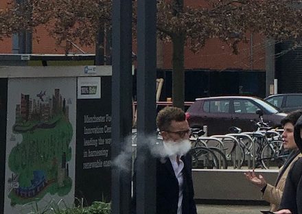 Man vaping outside of University