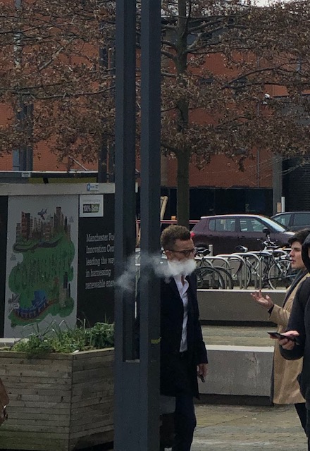 Man vaping outside of University