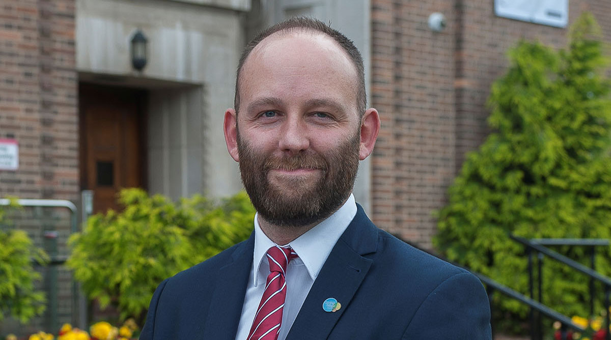 Salford city mayor Paul Dennett in front of Salford civic centre