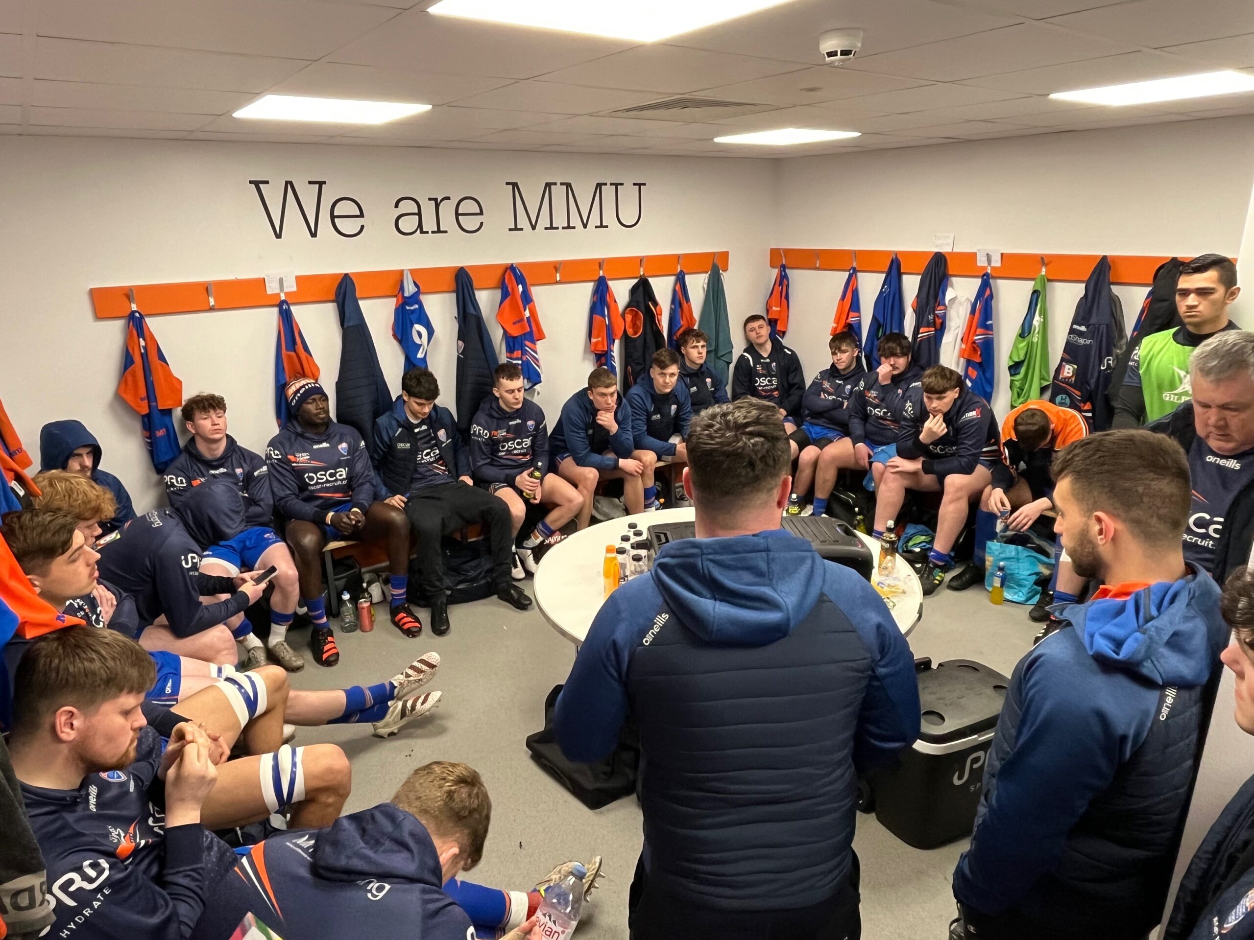The Man Met rugby squad preparing for a game n their dressing room