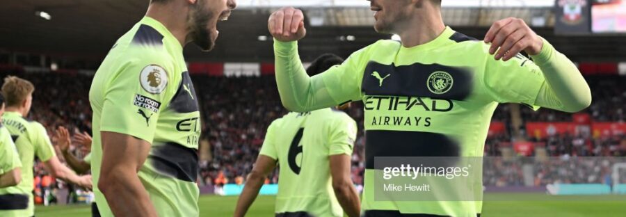 Rúben Dias and Jack Grealish Celebrating his goal in front of the fans.