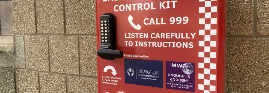 Red emergency bleed control box with white writing and a pin code