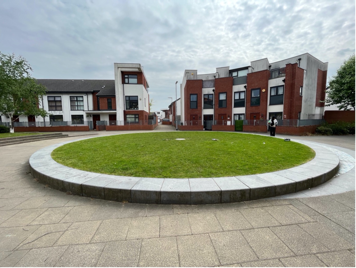 Centre point of Maine Road - a circle of grass in the middle of a street.