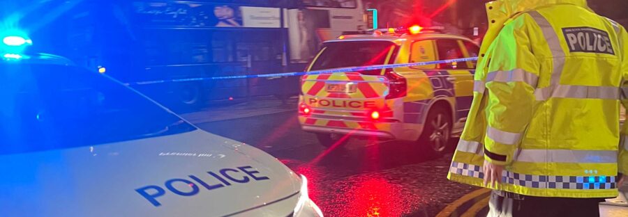 Police cars swarmed Manchester city centre after two men were knocked down by two buses.
