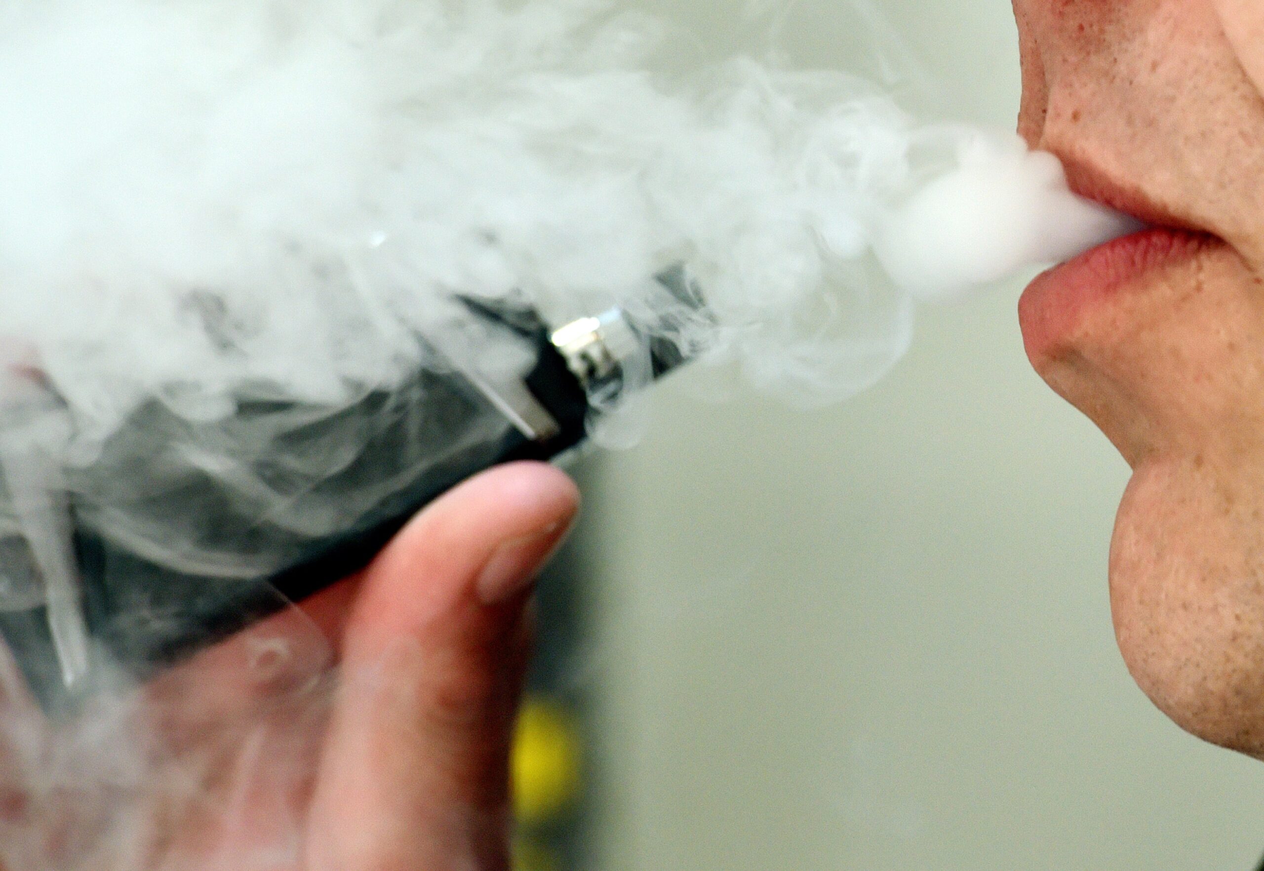 Man inhaling a vape