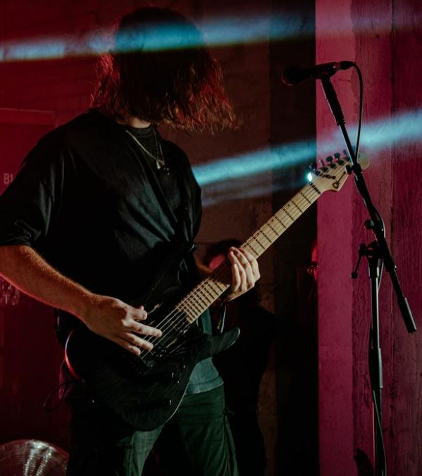 God Is An Astronaut, guitarist signing into microphone, shot by Kayleigh Fryer