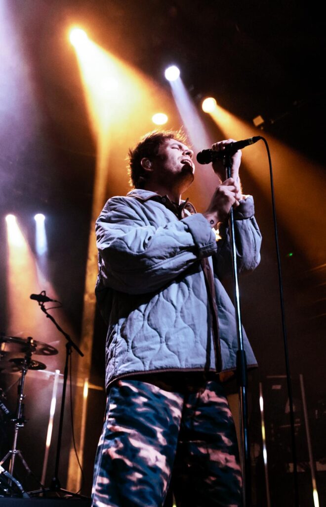Enter Shikari vocalist Rou Reynolds on their last UK arena tour, Photo taken by Nick Davarius