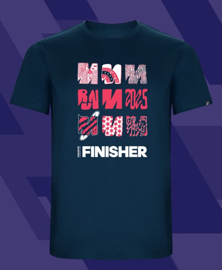 A navy blue T-shirt on a purple bakcground. It has three rows of pink and red 'M's o it, and says 'FINISHER' on the bottom