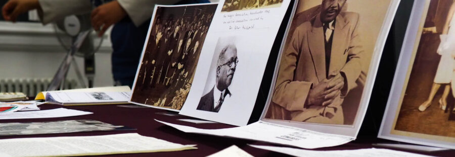 Fifth Pan-African Congress 80th anniversary display from the Ahmed Iqbal Ullah RACE Centre and Education Trust A spread of old sheets of typewritten paper in front of printed historical portraits propped up on a table.