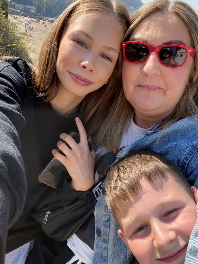 Woman with her two children, one boy and one girl