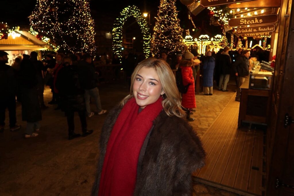 Elkie smiling at the Christmas markets 2025.