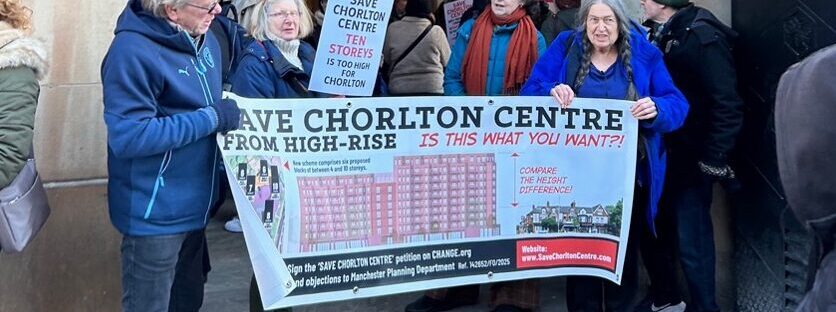 A group of people holding a campaign poster