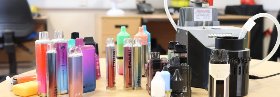 A photo of confiscated vapes with the detection device.