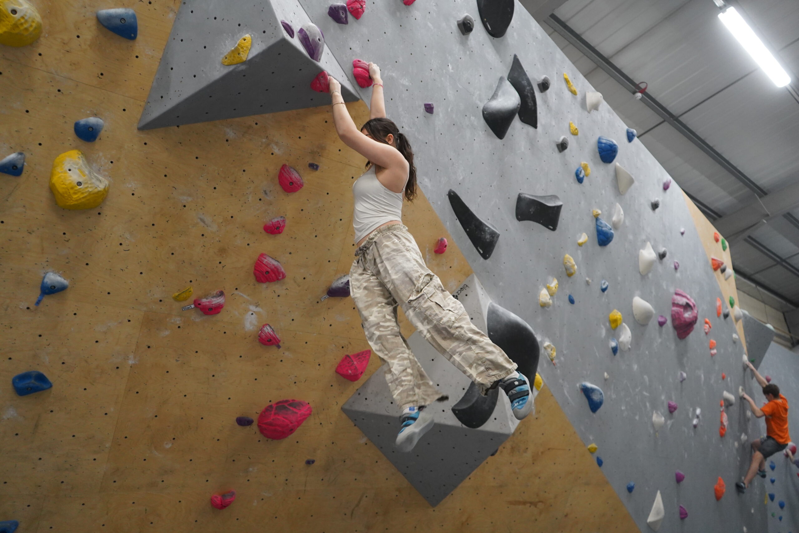 Woman climbing one of the bouldering walls