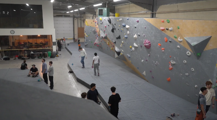 C;imbers at the indoor bouldering centre